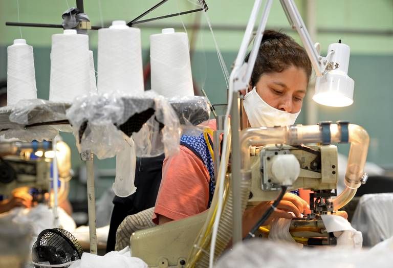 ASHEBORO, NORTH CAROLINA - Francisca Romero sews a product at the Bossong Medical plant in Asheboro, NC on Thursday, July 16, 2020. The Bossong Medical plant in Asheboro contracted to make Nufabrx items. The company is churning out hundreds of thousands of masks, including one order of 250,000 masks to the federal government. Image by Jeff Siner/The Charlotte Observer/North Carolina News Collaborative. United States, 2020.