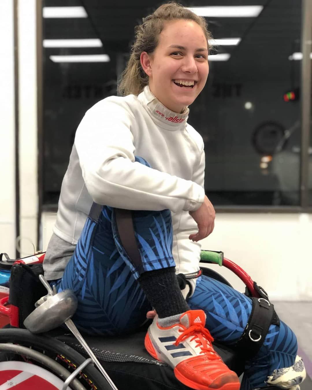Victoria laughs during a break from fencing at the Phoenix Center in Poughkeepsie, NY. Image courtesy of Victoria Isaacson. United States, 2019.