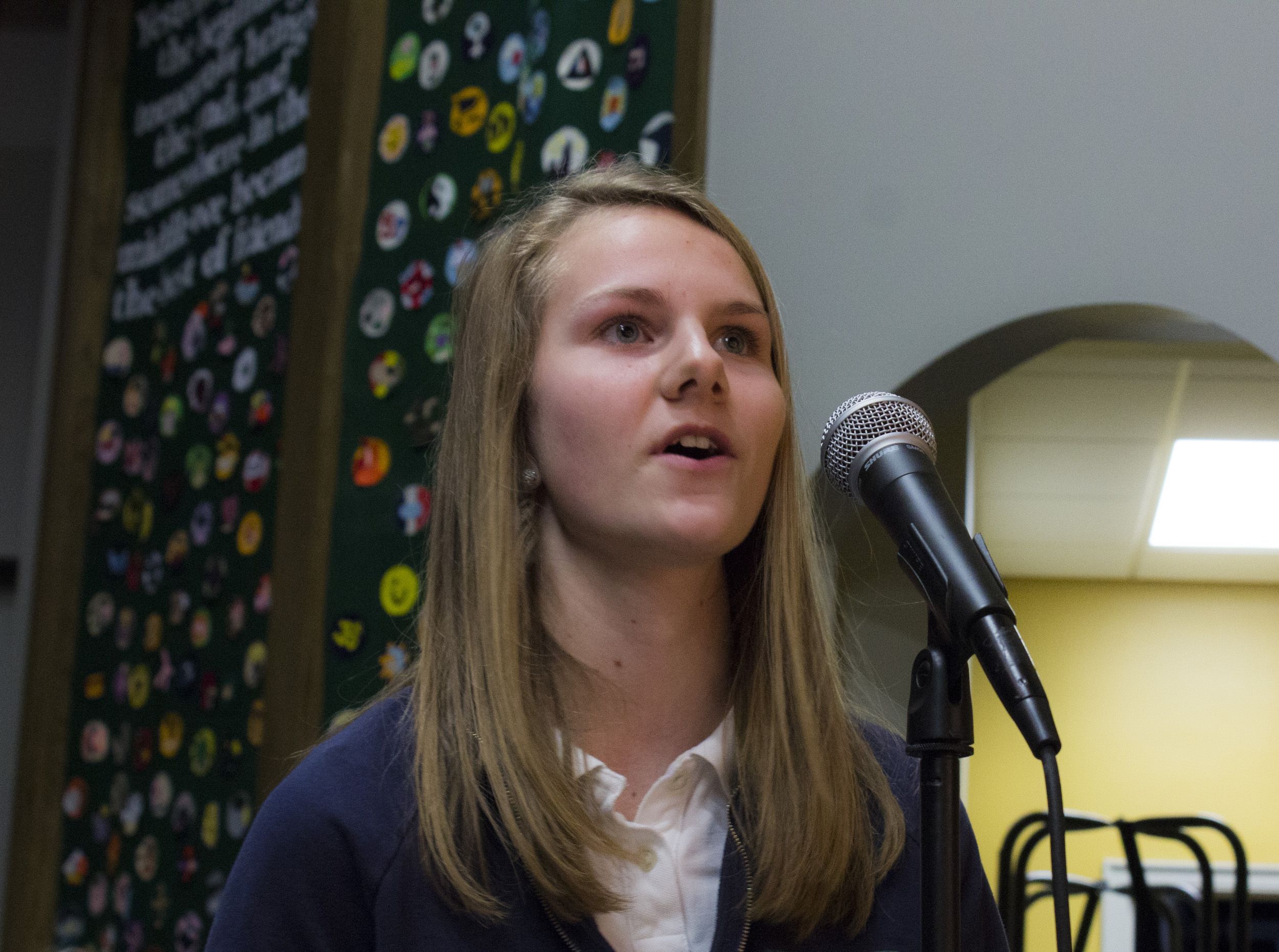 Grace Myers, a student, asks Madeleine Albright and Stephen Hadley a question about the Middle East Strategy Task Force, at Nerinx Hall High School in St. Louis, Missouri. Image by Lauren Shepherd, United States, 2017.
