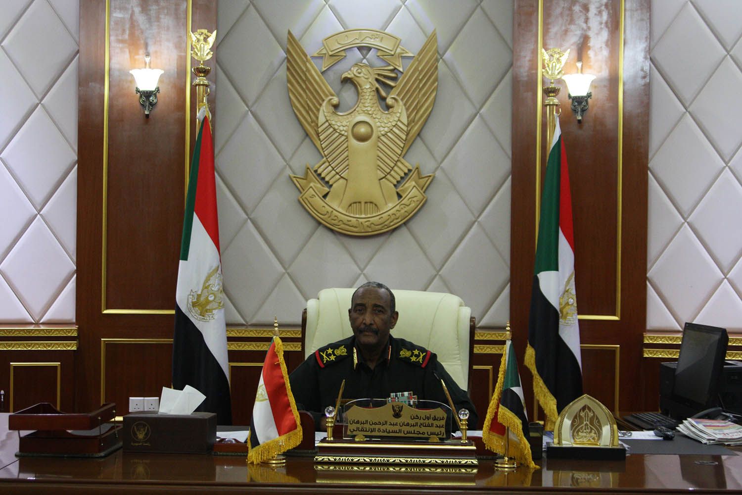 Lt. Gen. Abdel Fattah al-Burhan, the head of Sudan’s Sovereignty Council, sits at his desk in the presidential palace in Khartoum on Nov. 5. Image by Rebecca Hamilton/ Foreign Policy. Sudan, 2019.