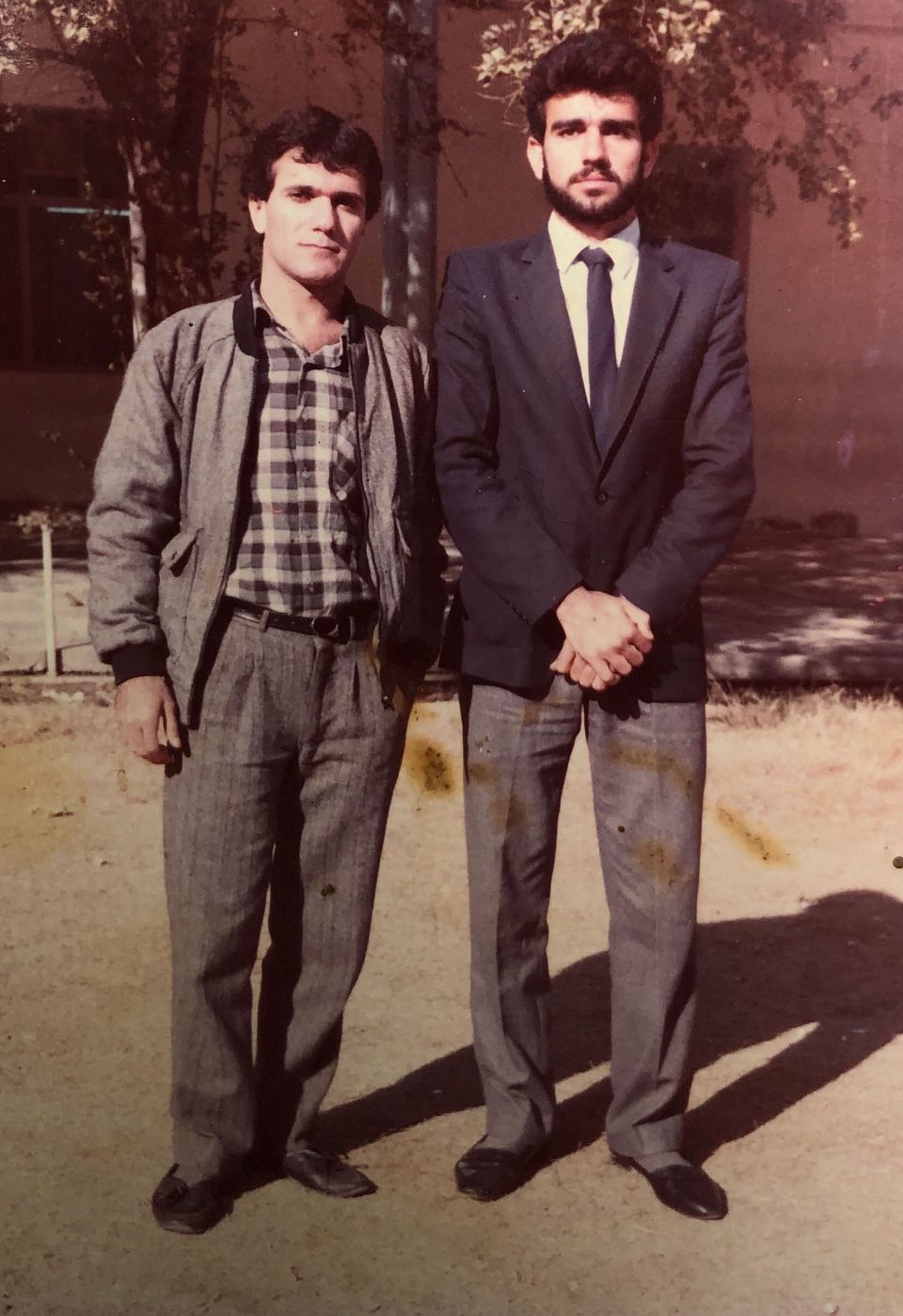 Mohammad Sibte, right, stands next to his cousin in front of his university in Baghdad. Image courtesy of Ahmad family. 