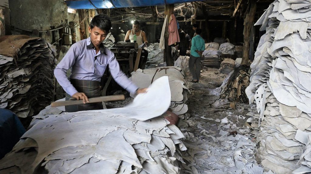 Workers process hides at a tannery in Dhaka’s Hazaribagh district. Leather in Bangladesh has grown to a $1 billion per year industry. Image by Justin Kenny. Bangladesh, 2016.
