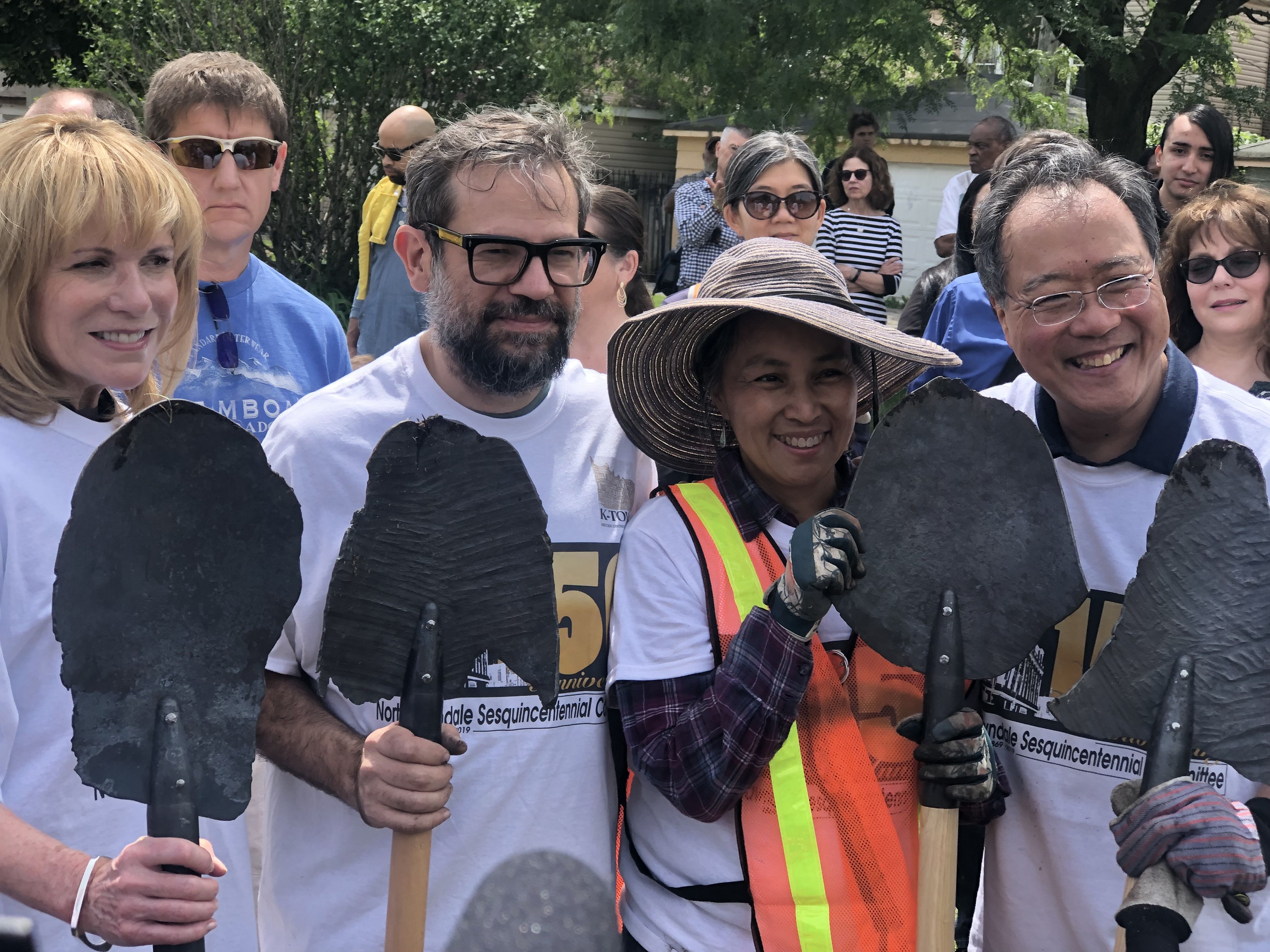 Artist Pedro Reyes and cellist Yo-Yo Ma prepare to plant trees with community members at North Lawndale's 150-year anniversary celebration, presenting Reyes' 2017 work "Palas por pistolas" (Guns into Shovels). Image by Terrance Patterson. United States, 2019.
