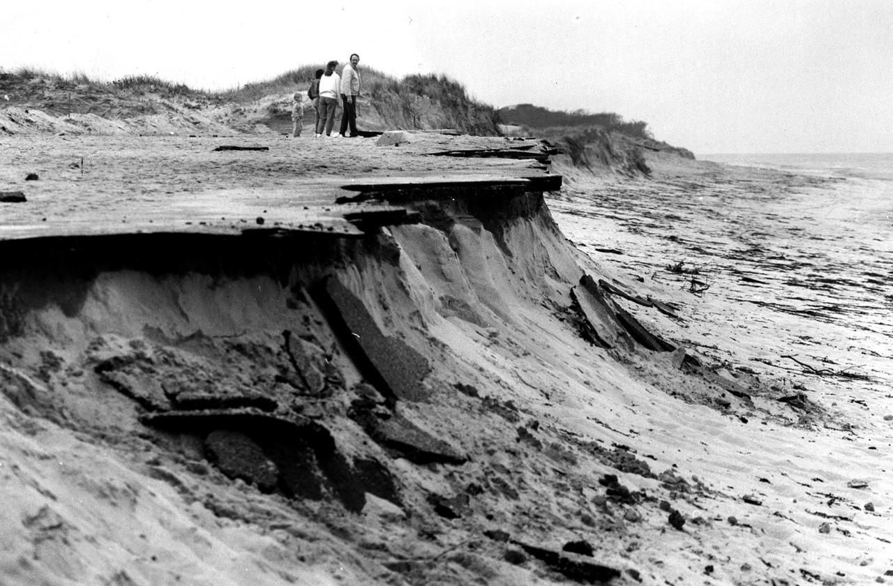 1991: Storm damage to the beach and parking lot at Meadow Beach in Truro after the "Perfect Storm" of 1991. Image by Mark Wilson. United States, 1991.