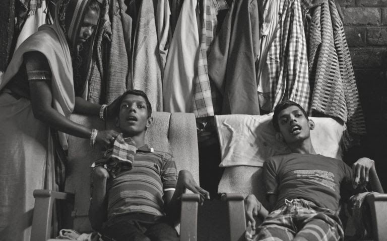 Living victims: Vikas Yadav, 19, and Aman Yadav, 17, brothers, have muscular dystrophy and are being cared for by their mother at their home. Affected by toxic waste which seeped into the groundwater, they will live short, painful lives. Image by Rohit Jain. India, 2018. 