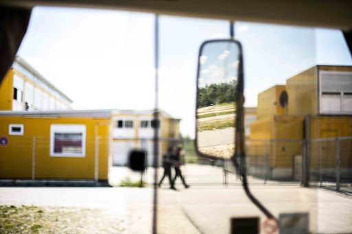 Security guards circle the Ingoldstadt ANKER centers in Bavaria, Germany. Guards are on site 24/7. Image by Angelica Ekeke. Germany, 2019.