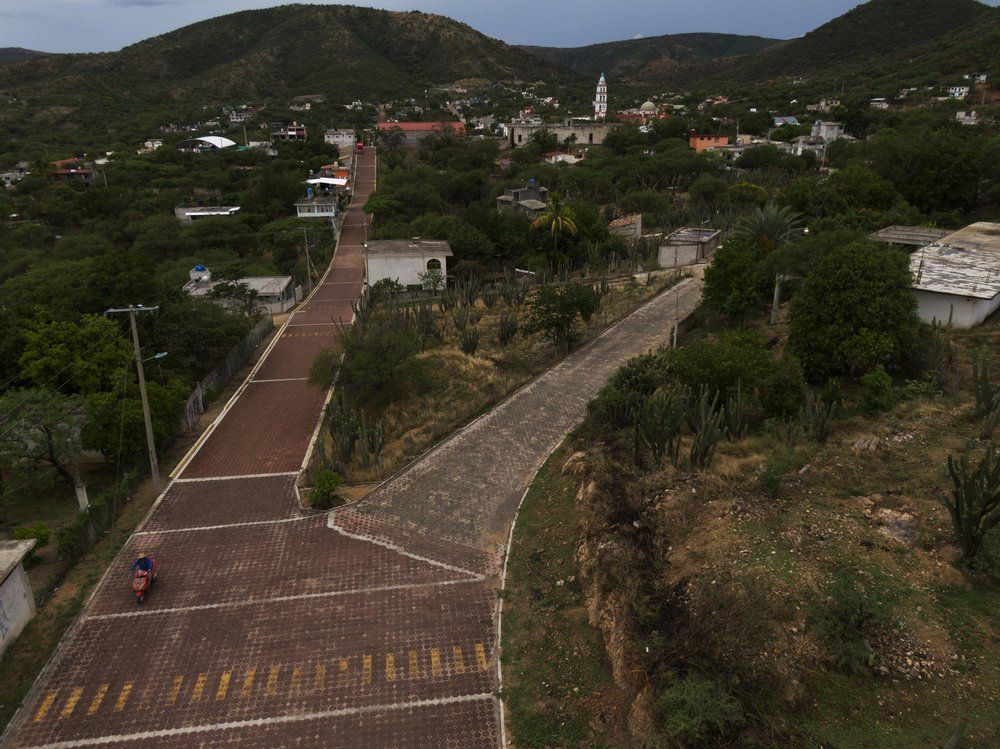 Small roads enter San Jeronimo Xayacatlan, Mexico, a town from which nearly a third of residents have emigrated to New York, Friday, June 26, 2020. Image by Fernando Llano/AP Photo. Mexico, 2020.