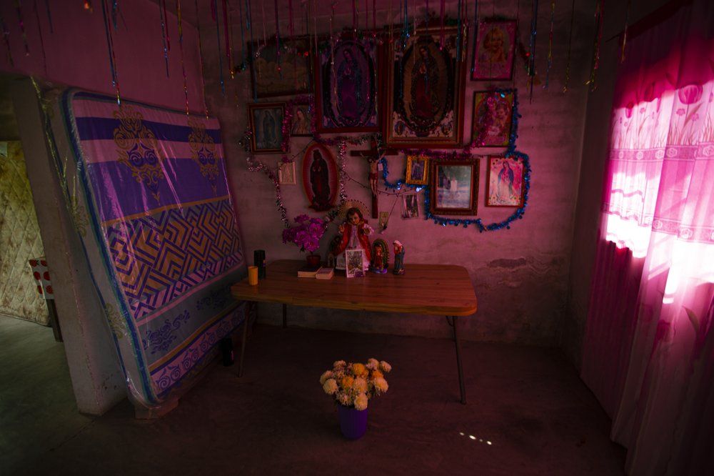 An altar stands in the home of Wilfrido Martinez, set it up in honor of his son Mauricio who died of COVID-19 in New York, in San Jeronimo Xayacatlan, Mexico, Friday, June 26, 2020. Image by Fernando Llano/AP Photo. Mexico, 2020.