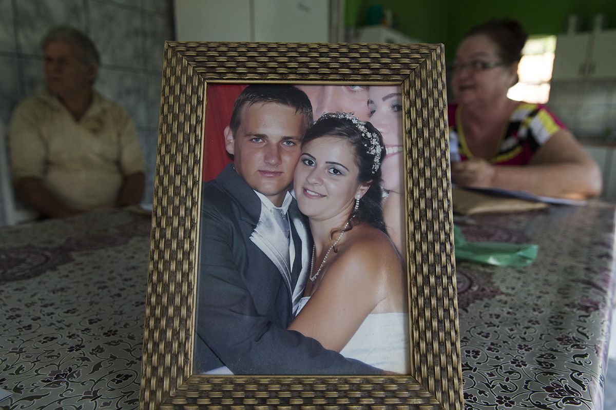 Virlei Braun is shown with his wife, Franciele Casagrande Strehlow, in their wedding photo on display at his parent's home in São João Pequeno. Braun was a 30-year-old father of a toddler son when he died of yellow fever. Image by Mark Hoffman. Brazil, 2017.