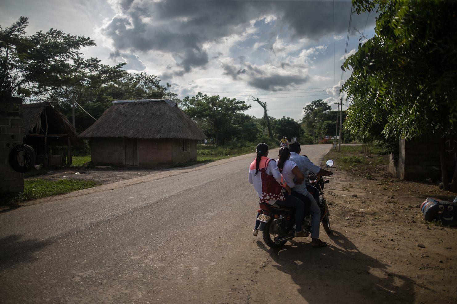 A family rides a motorcycle taxi to the clinic in Pichilín. Image by Ivan Valencia/For The Washington Post. Colombia, 2018.