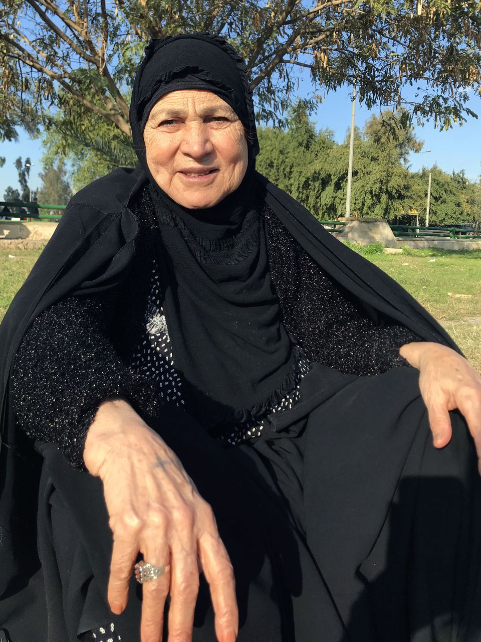 Fawziya Ali, Zahra Ahmad's grandmother, poses for a photo at a park in Baghdad, Iraq. Image courtesy of Ahmad family.
