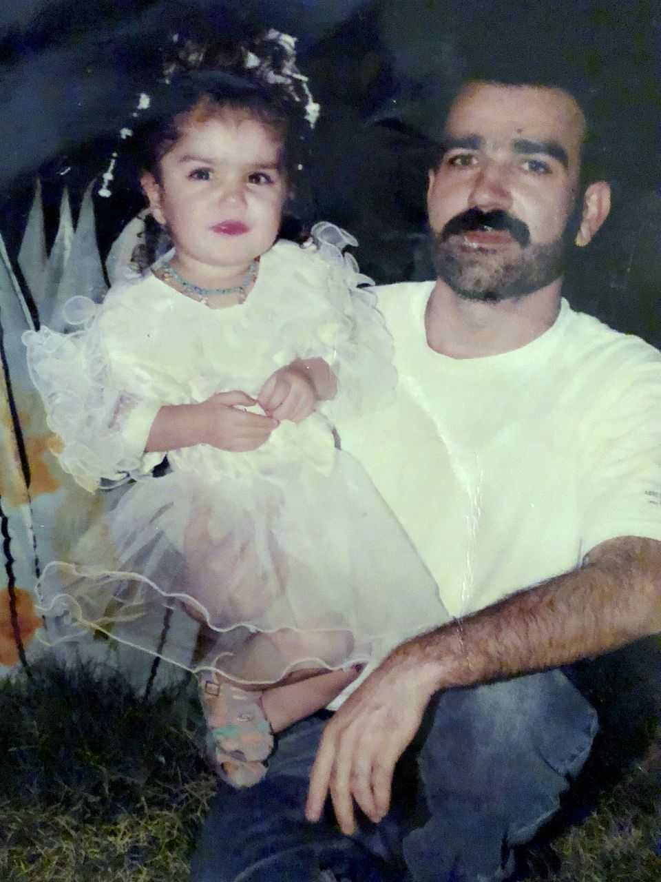 Mohammad Sibte holds his daughter Zahra Ahmad in Iraq. Image courtesy of Ahmad family.