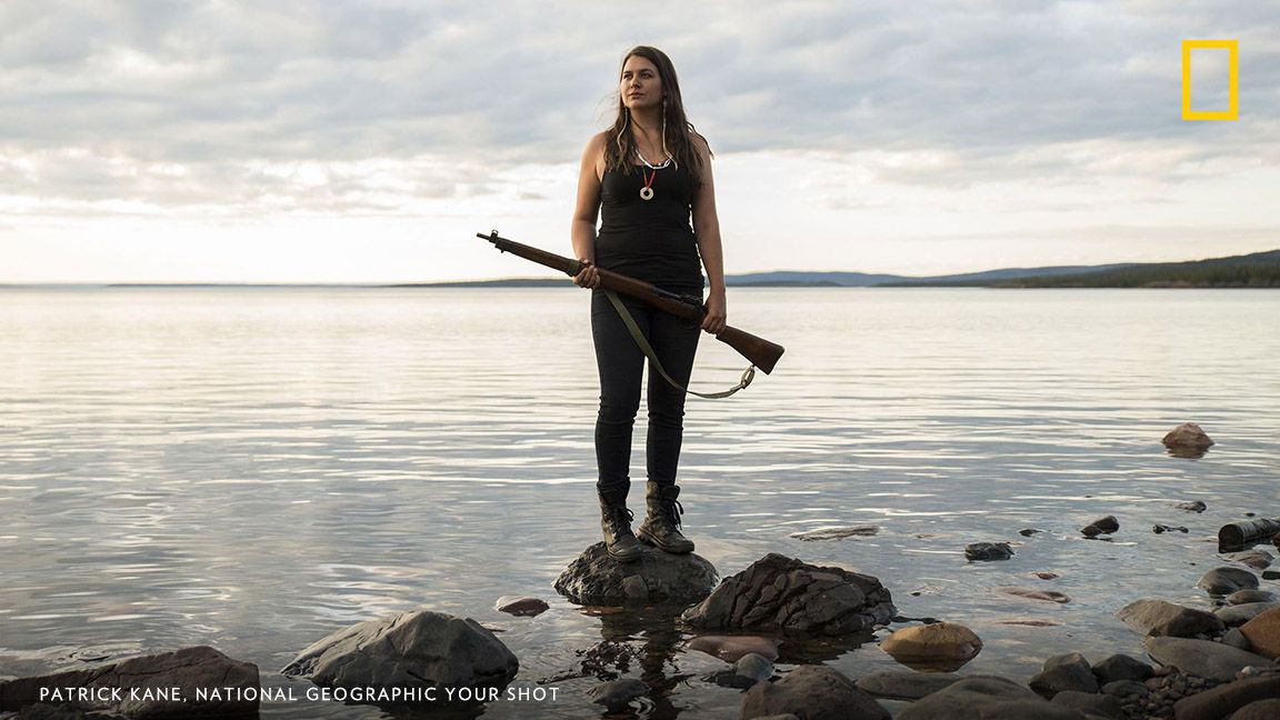 Tania Larsson stands on the shore of Great Slave Lake in Canada’s Northwest Territories near the community of Lutsel K’e. Larsson is part of a group of young indigenous leaders promoting culture, language, and conservation in Canada’s north. Image by Patrick Kane, National Geographic Your Shot.