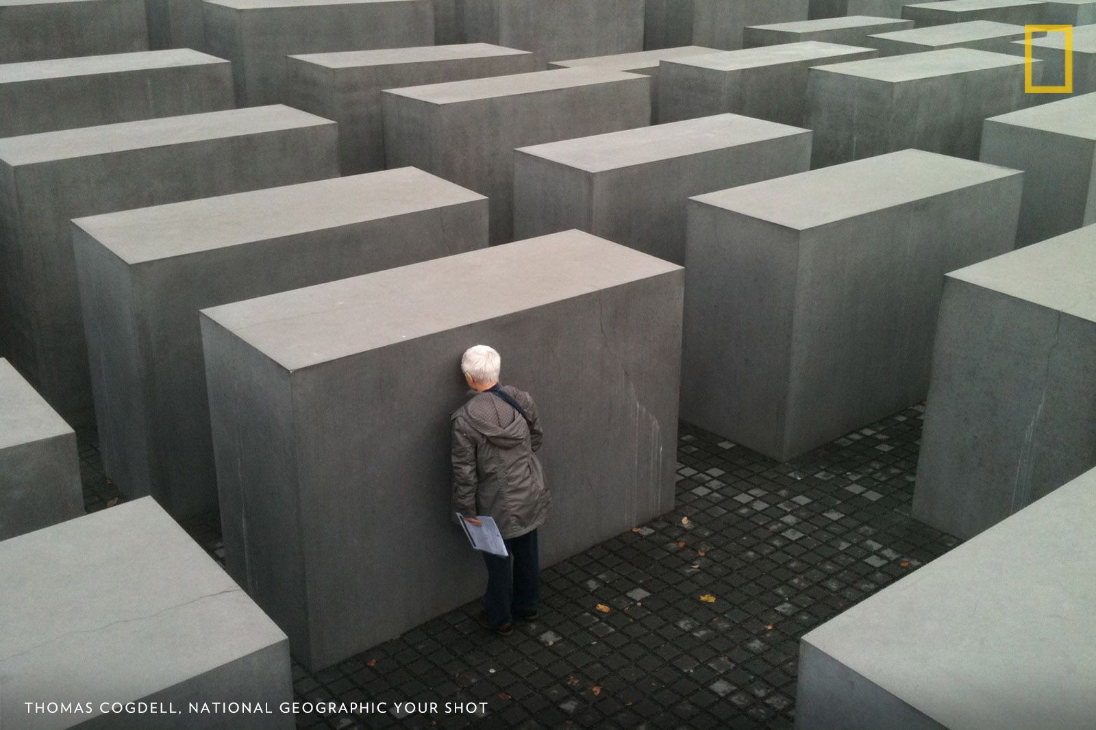 My good friend Hanna Miley is a survivor of the Holocaust. writes Your Shot photographer. She has done extensive research into her parents’ life and death, and [has] written an amazing book called ‘A Garland for Ashes,’ which shares the process of forgiveness and reconciliation. This is Hanna at the Holocaust Memorial in Berlin, having just emerged from the underground museum, where she had once again to choose hope in the face of remembered horror. Image by Thomas Cogdell, National Geographic Your Shot.
