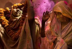 The exuberance of Holi, the holiday that includes flinging colored powders, was until recently thought inappropriate for widows. Aid groups, defying traditional prejudices against widows, now invite them to join celebrations like this Holi party in Vrindavan. Image by Amy Toensing. India, 2016.