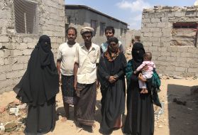 Souad and her family fled Basateen, a suburb of Aden, two months before this photo was taken. They may be safe from bombs, but they have become homeless in their own land and still face the daily threat of starvation. Image by Marcia Biggs. Yemen, 2018.