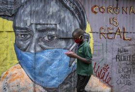 COVID-19 graffiti in Kibera slum, Kenya. Image by Henry Owino. Kenya, 2020.