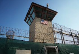 This photo, reviewed and approved by the U.S. military, shows a guard tower in the Detention Center Zone at Guantánamo Bay, Cuba. Image by Doug Mills / The New York Times. Cuba, 2019.