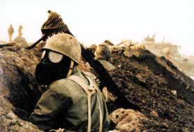 An Iranian soldier wearing a gas mask during the Iran-Iraq War. In the waning days of the war, Iraq resorted more frequently to bombarding soldiers and civilians with sulfur mustard and nerve agents. Image licensed under CC BY-SA 3.0.